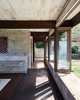 Modern home with Hallway. Looking closely at various surfaces of the cinder block walls you’ll see a mottled look: fresh stucco was made with sand from Waimanalo mixed with concrete and water. Photo 10 of Live inspired in this Japanese Musician's midcentury indoor/outdoor home asking $2.95 million