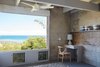 Modern home with Bedroom and Chair. Large glass panels and exposed wood lead the eye to look at the home differently from every view. Photo 11 of Live inspired in this Japanese Musician's midcentury indoor/outdoor home asking $2.95 million