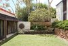 Modern home with Outdoor, Shrubs, Trees, and Grass. Bold lines frame an intimate indoor/outdoor courtyard and allow privacy while uniting the home with nature. Photo 13 of Live inspired in this Japanese Musician's midcentury indoor/outdoor home asking $2.95 million