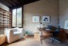 Modern home with Office, Lamps, Shelves, Chair, Storage, Study Room Type, and Desk. Current owner Ryuichi Sakamoto is a composer, musician, producer, and environmental activist; he has stood the test of time and continues to break new ground. Sakamoto’s devotion to environmental concerns – to turning ego into eco, as he puts it, fits with the feel of the home.
His project “more trees” https://www.more-trees.org/en/ contributes to carbon offset through active forestation. “more trees” contributes to maintaining forests by planting seedlings and offering carbon offset credits to individuals and corporations looking to reduce their carbon footprint. Photo 14 of Live inspired in this Japanese Musician's midcentury indoor/outdoor home asking $2.95 million