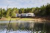 Modern home with Exterior and House. Lakeside Splinter Creek Home Photo of The Splinter Creek Home