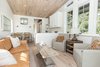 Modern home with Living Room, Sofa, Recessed Lighting, and Light Hardwood Floor. The home features Oak hardwood floors and energy effiecient windows and doors throughout. Photo 3 of Saltbox Tiny Home