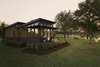Modern home with Exterior, Wood Siding Material, Prefab Building Type, Saltbox RoofLine, Tiny Home Building Type, and Metal Roof Material. The 452 sq. ft. home includes a covered porch for additional living space. Photo 5 of Saltbox Tiny Home