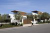 Modern home with Exterior, Wood Siding Material, Metal Roof Material, Flat RoofLine, House Building Type, and Concrete Siding Material. Street view showing the subtle presence Photo of Observatory House