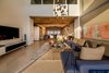 Modern home with Living Room, Sofa, Marble Floor, Console Tables, Coffee Tables, Pendant Lighting, and Rug Floor. Double Height Family Living Photo of Aurum Penthouse