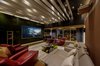 Modern home with Living Room, Accent Lighting, Sofa, Console Tables, Ceiling Lighting, and Coffee Tables. Home Theatre / Party Space Photo 19 of Aurum Penthouse