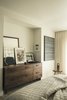Modern home with Light Hardwood Floor and Chair. A dresser was custom fit inside this niche in the master bedroom. It was made by Kaimade Woodworking with Claro walnut. Photo 20 of Balboa Residence