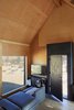 Modern home with Living Room, Sofa, Wall Lighting, and Concrete Floor. Living Photo 3 of Folly | Off Grid