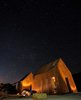 Modern home with Exterior. Exterior at night Photo 15 of Folly | Off Grid