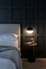 Modern home with Bedroom, Bed, Night Stands, Pendant Lighting, and Light Hardwood Floor. Contrasting black and white orb pendants on both sides of the bed provide warm light for bedtime reading or for writing in the guest journal. Photo 5 of Normal Heights Residence