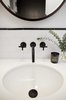 Modern home with Bath Room, Enclosed Shower, and Subway Tile Wall. Black powder-coated faucets contrast the white sink and tiles. Photo 10 of Normal Heights Residence