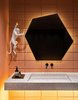 The first-floor bathroom is deliberately made in bright colors to wow the guests. The main accent here is the unplastered wall from concrete blocks and the self-levelling floor in a warm pink shade. The central element of the bathroom is a spotted acrylic console sink with an asymmetrical polygonal mirror. Photo 14 of VOV apartment modern home
