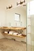 Modern home with Bath Room, Porcelain Tile Wall, Vessel Sink, Wall Lighting, Ceiling Lighting, Concrete Floor, Wood Counter, Two Piece Toilet, and Full Shower. Local Guanacaste wood countertops Photo 6 of Casa Ilios (Seven Bedrooms)