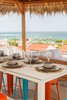 Modern home with Outdoor, Rooftop, Hardscapes, Front Yard, Large Patio, Porch, Deck, Concrete Patio, Porch, Deck, and Hanging Lighting. Lunch with a view Photo 5 of Casa Ilios (Seven Bedrooms)