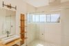 Modern home with Bath Room, Porcelain Tile Wall, Ceiling Lighting, Vessel Sink, Concrete Floor, Wall Lighting, Two Piece Toilet, Wood Counter, and Full Shower. Huge rain shower with a view Photo 7 of Casa Ilios (Seven Bedrooms)