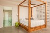 Modern home with Bedroom, Ceiling Lighting, Concrete Floor, Bed, Shelves, Storage, Wall Lighting, and Night Stands. Minimalist Master Photo 16 of Casa Ilios (Seven Bedrooms)