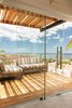 Modern home with Outdoor, Trees, Hardscapes, Grass, Wood Patio, Porch, Deck, Small Patio, Porch, Deck, Wire Fences, Wall, and Gardens. VIP deck off the master with shadows from our custom pergola Photo 14 of Casa Ilios (Seven Bedrooms)
