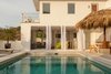 Modern home with Outdoor, Side Yard, Swimming Pools, Tubs, Shower, Landscape Lighting, and Concrete Fences, Wall. Pool Cabana complete with hotel ice maker, beverage center and TV !! Photo 18 of Casa Ilios (Seven Bedrooms)