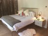 Modern home with Bedroom, Table Lighting, Night Stands, Bed, Storage, Light Hardwood Floor, Track Lighting, Dresser, and Ceiling Lighting. Master bedroom on the river Photo 2 of Modern Riverfront Townhouse in Aspen