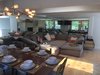 Modern home with Living Room, Light Hardwood Floor, Chair, Track Lighting, Ceiling Lighting, Wood Burning Fireplace, Bench, End Tables, and Sectional. open loft livingroom with a balcony over the river Photo 7 of Modern Riverfront Townhouse in Aspen
