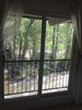 Modern home with Bedroom, Table Lighting, Night Stands, Ceiling Lighting, Light Hardwood Floor, Storage, Bed, Dresser, and Track Lighting. Master bedroom overlooks the Roaring Fork River Photo of Modern Riverfront Townhouse in Aspen