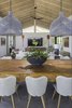 Modern home with Living Room, Pendant Lighting, and Porcelain Tile Floor. Great Room Photo 3 of Manini`owali 3