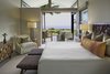 Modern home with Bedroom, Night Stands, Chair, Bed, and Porcelain Tile Floor. Master Bedroom Photo 10 of Manini`owali 3
