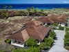 Modern home with Exterior, Stone Siding Material, Shingles Roof Material, Stucco Siding Material, Hipped RoofLine, Wood Siding Material, and Beach House Building Type. Aerial View Photo of Manini`owali Villa 5