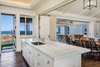 Modern home with Kitchen, Recessed Lighting, Stone Counter, Dark Hardwood Floor, White Cabinet, and Undermount Sink. Kitchen Photo 13 of Manini`owali Villa 5