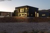 Modern home with Exterior, Metal Siding Material, Metal Roof Material, Flat RoofLine, Stucco Siding Material, and House Building Type. exterior twilight Photo 8 of The Rubber Ducky Trail House