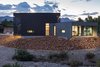 Modern home with Exterior, House Building Type, Stucco Siding Material, Flat RoofLine, Metal Roof Material, and Metal Siding Material. exterior twilight Photo 9 of The Rubber Ducky Trail House