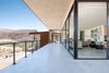 Modern home with Outdoor, Vertical Fences, Wall, Large Patio, Porch, Deck, Hardscapes, Metal Fences, Wall, Concrete Pools, Tubs, Shower, Metal Patio, Porch, Deck, Boulders, and Concrete Patio, Porch, Deck. wrap around balcony and sliding glass panels unveil this great room and mountain views Photo of The Arroyo House