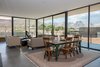 Modern home with Living Room, Concrete Floor, Sofa, Chair, Two-Sided Fireplace, and Ceiling Lighting. interior views Photo 7 of The Arroyo House
