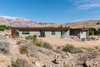 Modern home with Exterior, Metal Roof Material, House Building Type, Flat RoofLine, Concrete Siding Material, and Metal Siding Material. front exterior/red rock canyon mountain range Photo 6 of The Arroyo House