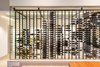 Modern home with Dining Room, Ceiling Lighting, Recessed Lighting, Limestone Floor, and Table. wine cooler Photo 9 of Cloud Chaser