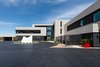 Modern home with Exterior, Stucco Siding Material, Concrete Siding Material, Metal Roof Material, House Building Type, Metal Siding Material, and Flat RoofLine. Front exterior from driveway Photo 6 of The Huhn House