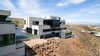 Modern home with Exterior, Flat RoofLine, Metal Siding Material, Concrete Siding Material, Stucco Siding Material, Metal Roof Material, and House Building Type. Side profile from street nearby Photo 3 of The Huhn House