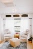 Modern home with Living Room, Chair, Table Lighting, Light Hardwood Floor, Ottomans, Ceiling Lighting, Lamps, Rug Floor, and End Tables. This area now makes a beautiful spot to curl up and read a book.
Photo 10 of The Cougar