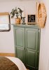 "We decided to bring the kale-green shade from the kitchen into the bedroom by painting the wardrobe green," adds Lauren.
Photo 18 of The Cougar modern home