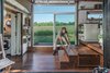 Modern home with Dining Room, Storage, Medium Hardwood Floor, Bench, Ceiling Lighting, and Table. Dining Table Photo 6 of The Alpha