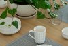 Modern home with Dining Room, Table, Ceiling Lighting, Medium Hardwood Floor, and Chair. The Dining Table: Grid lines and Geometrical Shapes meet Natural Wood and Plants Photo 4 of The Flea Market Apartment