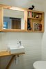 Modern home with Bath Room, Wood Counter, Ceramic Tile Floor, Ceiling Lighting, One Piece Toilet, and Ceramic Tile Wall. The Guest Bathroom Photo 9 of The Flea Market Apartment