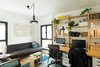 Modern home with Office, Lamps, Study Room Type, Medium Hardwood Floor, Chair, Storage, Bookcase, Shelves, and Desk. The Multifunctional Study Room Photo 11 of The Flea Market Apartment