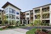 Modern home with Exterior, Glass Siding Material, Apartment Building Type, Shingles Roof Material, Concrete Siding Material, Flat RoofLine, and Stucco Siding Material. 1177 @Greystone Exterior Photo of 1177 @Greystone