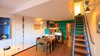 Modern home with Dining Room, Wall Lighting, Chair, Storage, Medium Hardwood Floor, Table, Shelves, Lamps, Accent Lighting, and Bar. Rebuilt Stair 2017, original design by Jean Prouve Photo 5 of Corbusier Re-Renovation Berlin