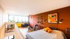Modern home with Bedroom, Chair, Medium Hardwood Floor, Shelves, Wall Lighting, Bench, Storage, Night Stands, Bed, and Accent Lighting. Bedroom area, original Bris e Soleil form Marseille 1952 Photo 8 of Corbusier Re-Renovation Berlin