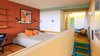 Modern home with Bath Room, Ceiling Lighting, Ceramic Tile Floor, Accent Lighting, One Piece Toilet, Wall Mount Sink, Freestanding Tub, Open Shower, Ceramic Tile Wall, Full Shower, Wall Lighting, Medium Hardwood Floor, and Mosaic Tile Wall. Open bathroom, copied form Villa Savoie, 2017 Photo 11 of Corbusier Re-Renovation Berlin