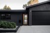 Modern home with Exterior, House Building Type, Stucco Siding Material, Mid-Century Building Type, and Shingles Roof Material. Clean lines and a sleek black exterior welcome you to this North Highland Park hilltop home. Photo of Raber By VEIN