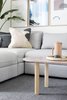 Modern home with Living Room, Sofa, and Coffee Tables. SOPHISTICATED COFFEE TABLE: Legs of Ikea Stockholm Coffee Table paired with new custom stadium shape tabletop in terra cotta colour. Photo 4 of Hawthorne by Mosaic Homes in Collaboration with Laura Melling