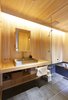 Modern home with Bath Room, Stone Counter, Tile Counter, Wall Lighting, Wood Counter, Ceramic Tile Floor, and Open Shower. bath with Japanese "HINOKI" wall Photo 4 of My Kyoto Town House